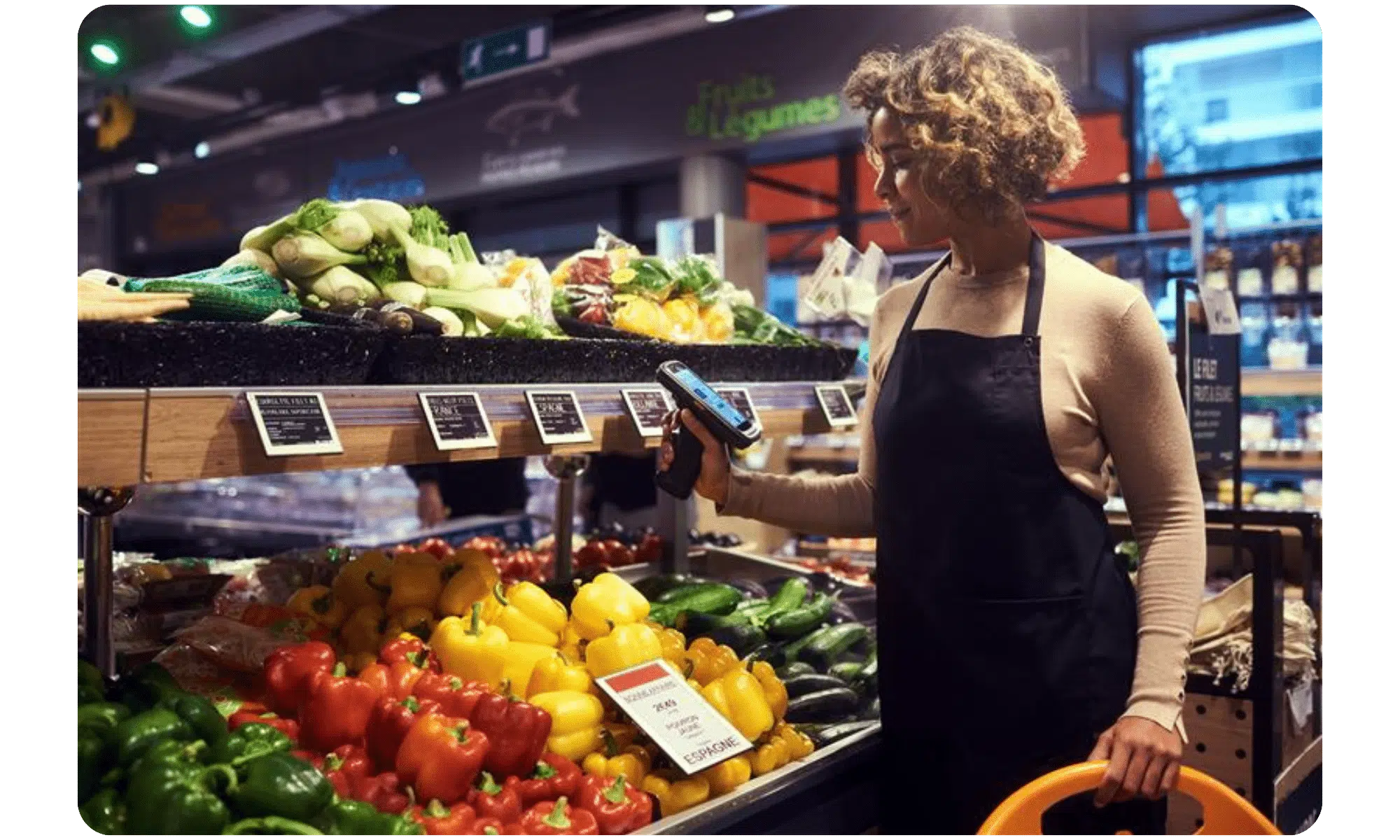 Woman shopping for vegetables with phone